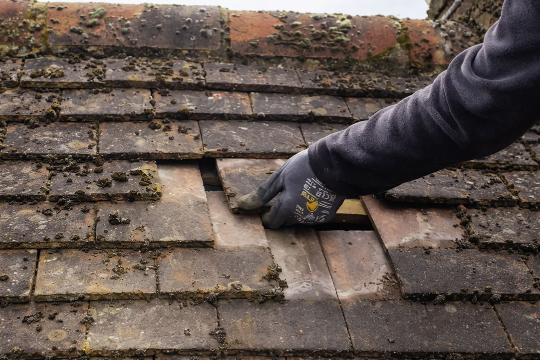 repairing roof leak after a slipped tile